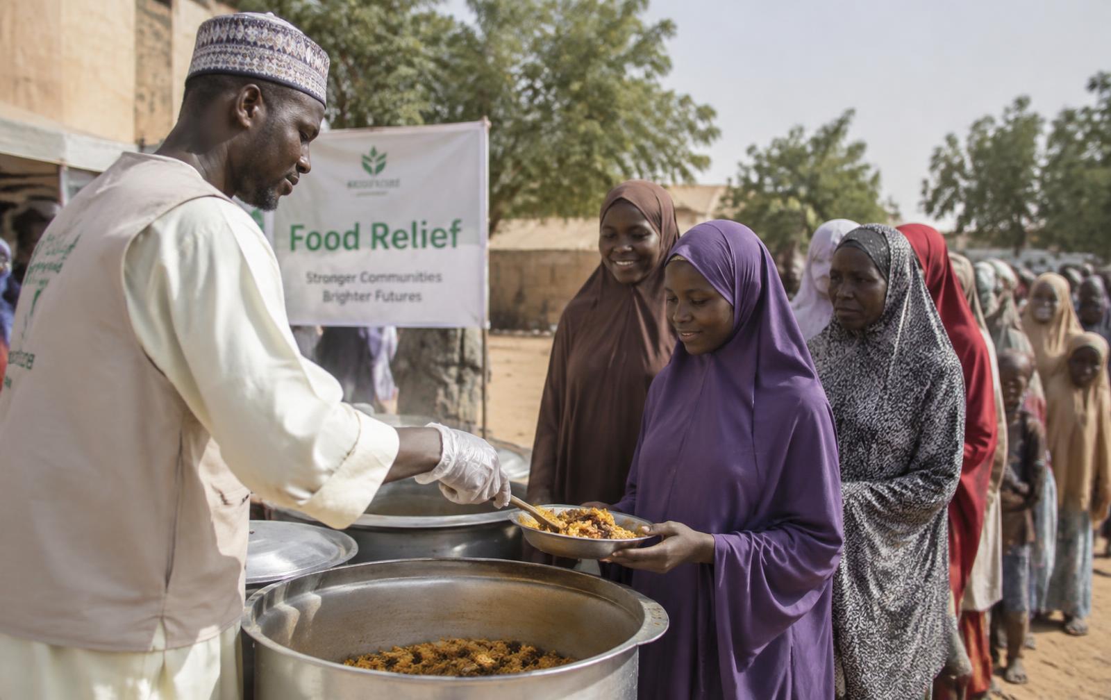 Volunteers serving meals at a community food outreach