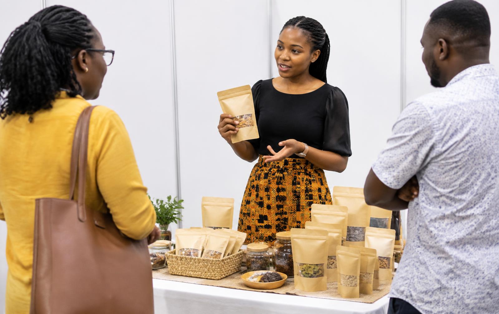 A young entrepreneur presenting packaged food products