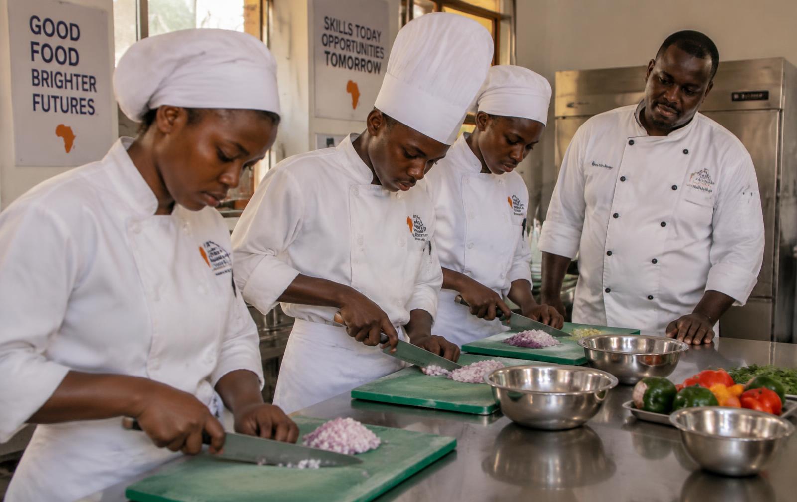 Young trainee chefs working together in a kitchen